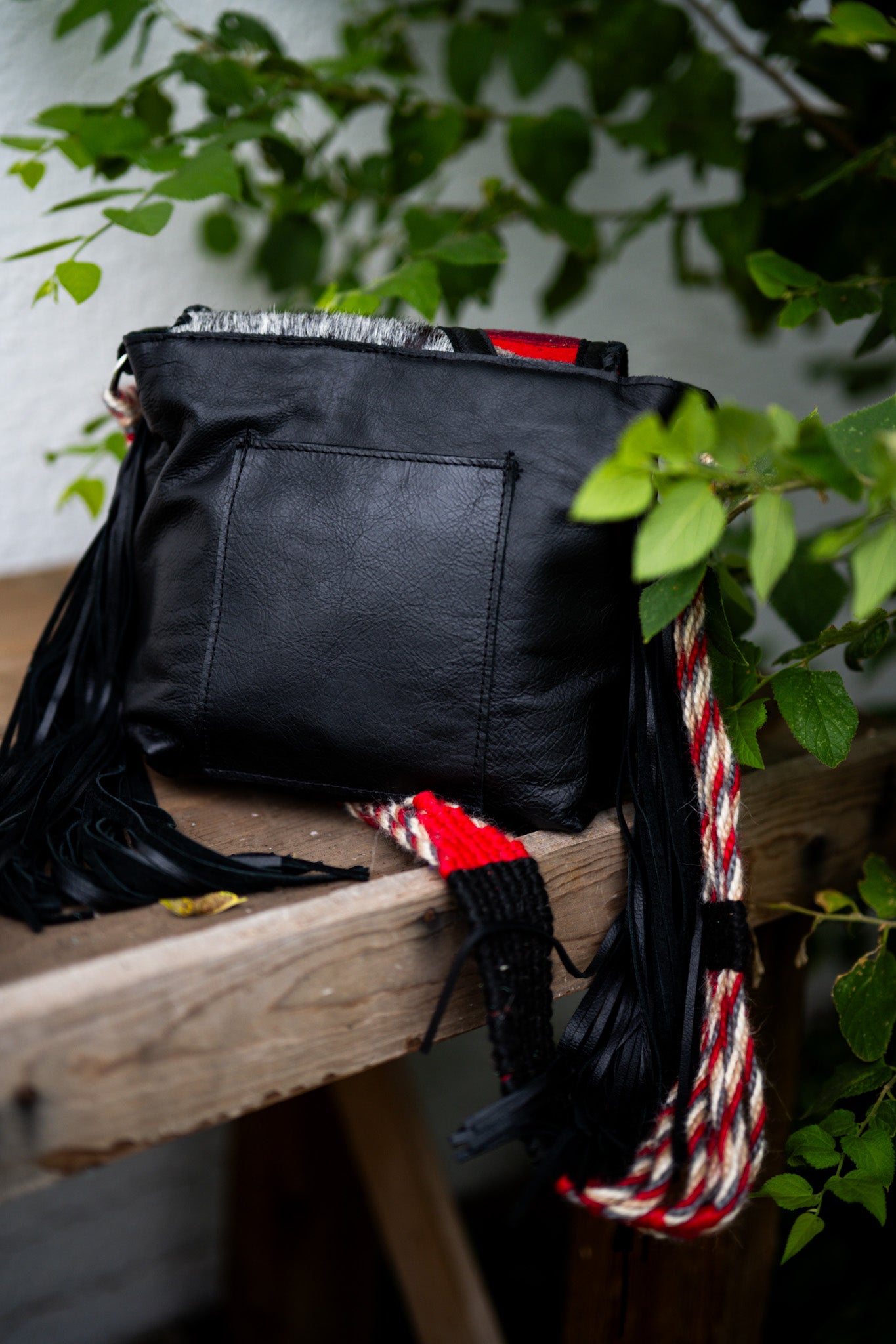 Cinch strap flap bag